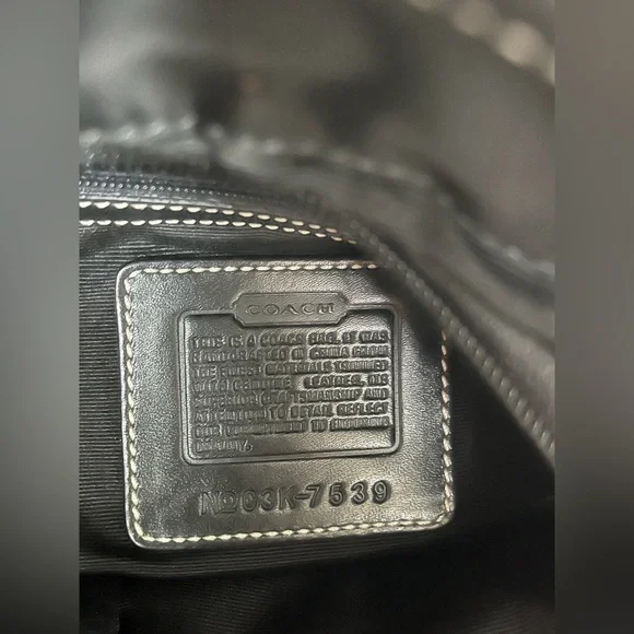 COACH canvas backpack and COACH leather wallet.